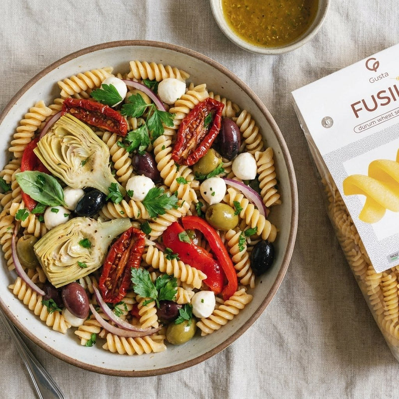 Antipasto Pasta Salad plated with Gusta Fusilli Pasta alongside