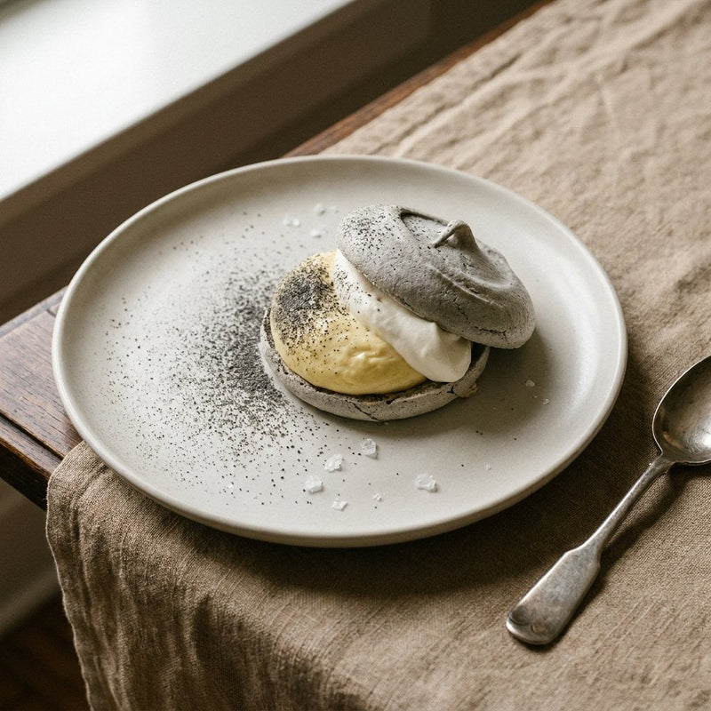 Corn husk meringue cracked around corn mascarpone mousse and vanilla cream