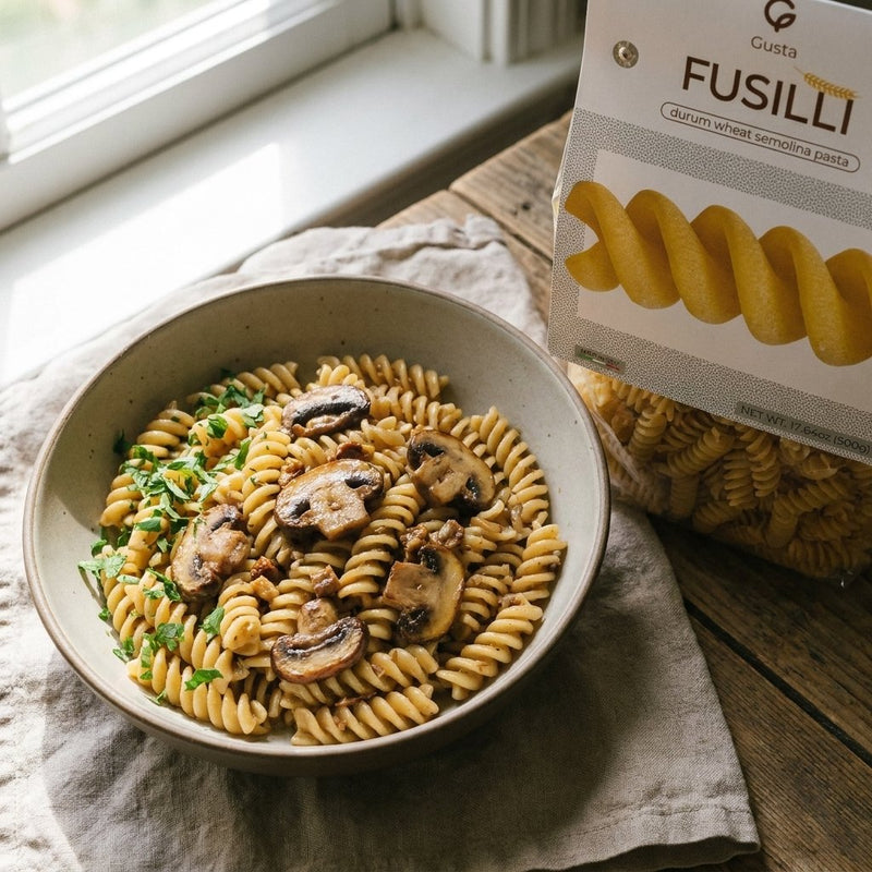 Fusilli ai Funghi with browned mushrooms and the Gusta fusilli package alongside