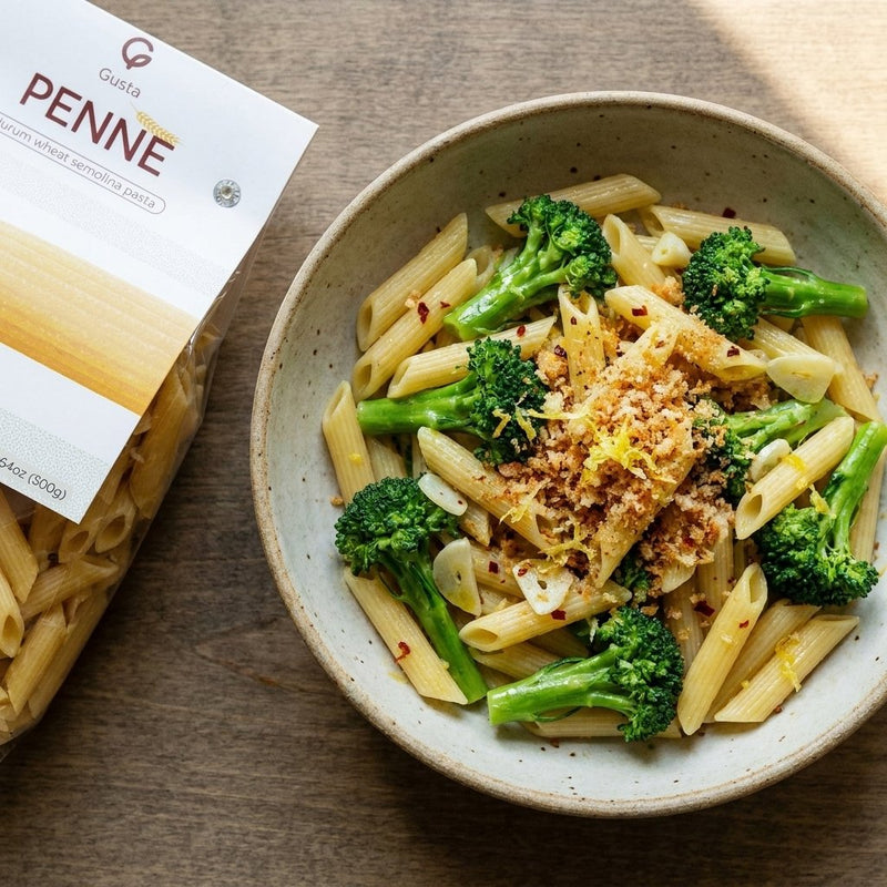 Pasta con Broccoli plated with Gusta Penne Rigate Pasta alongside