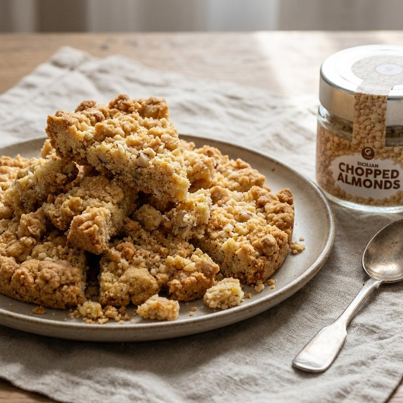 Sbrisolona broken into pieces with the Gusta chopped almonds package alongside